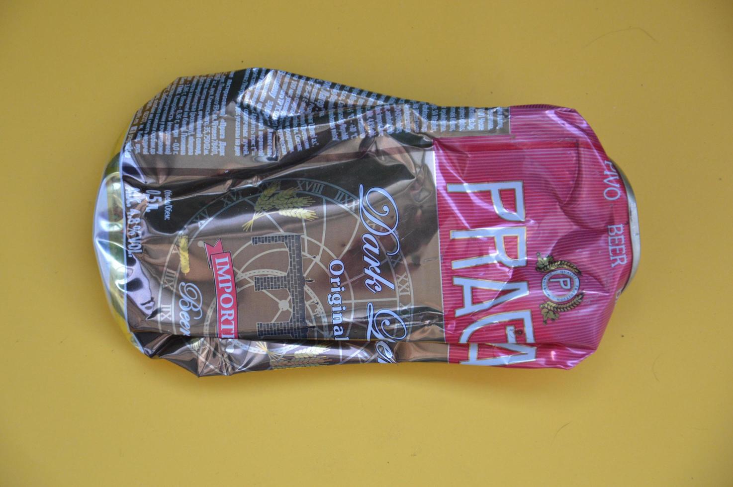 KIEV, UKRAINE - DECEMBER 22, 2021 Crumpled beer cans for scrap photo