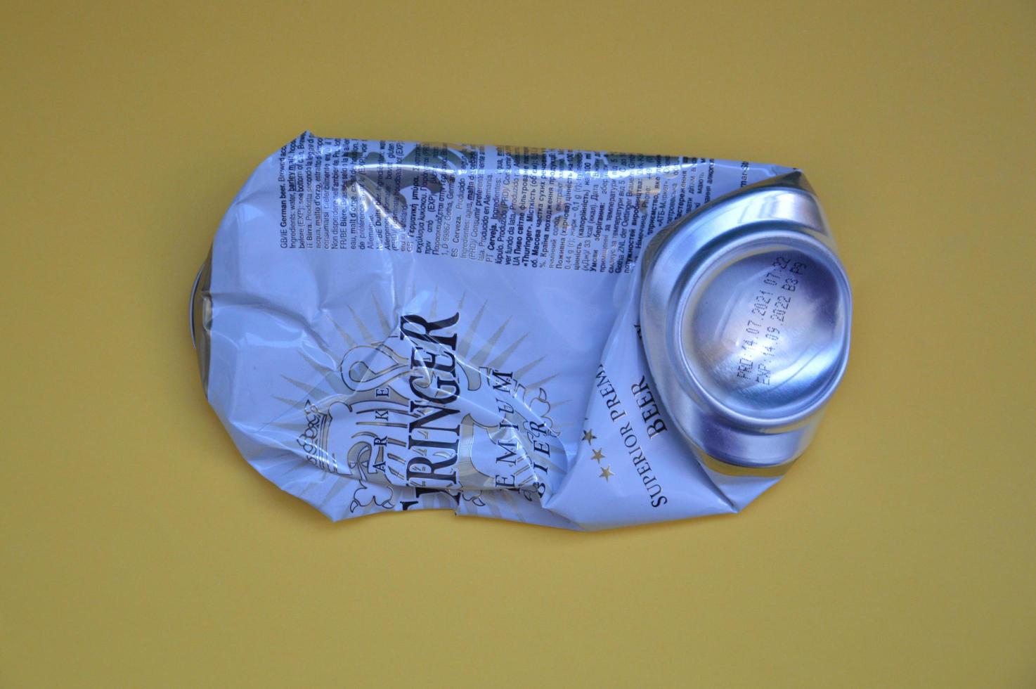 KIEV, UKRAINE - DECEMBER 22, 2021 Crumpled beer cans for scrap photo