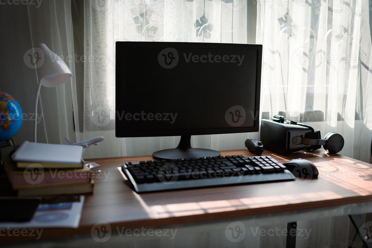 A computer monitor on a desk photo