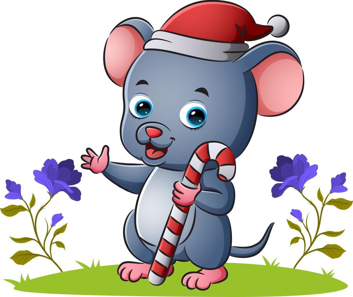 El ratón con gorro de Papá Noel sostiene el palito de caramelo. vector