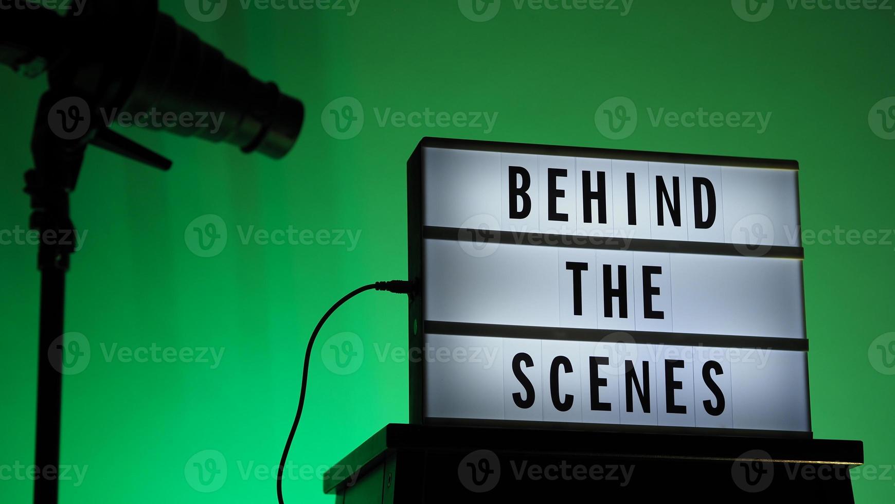 Movie board light box on studio stair and light Snoot tripod on colors gradiant Background. photo