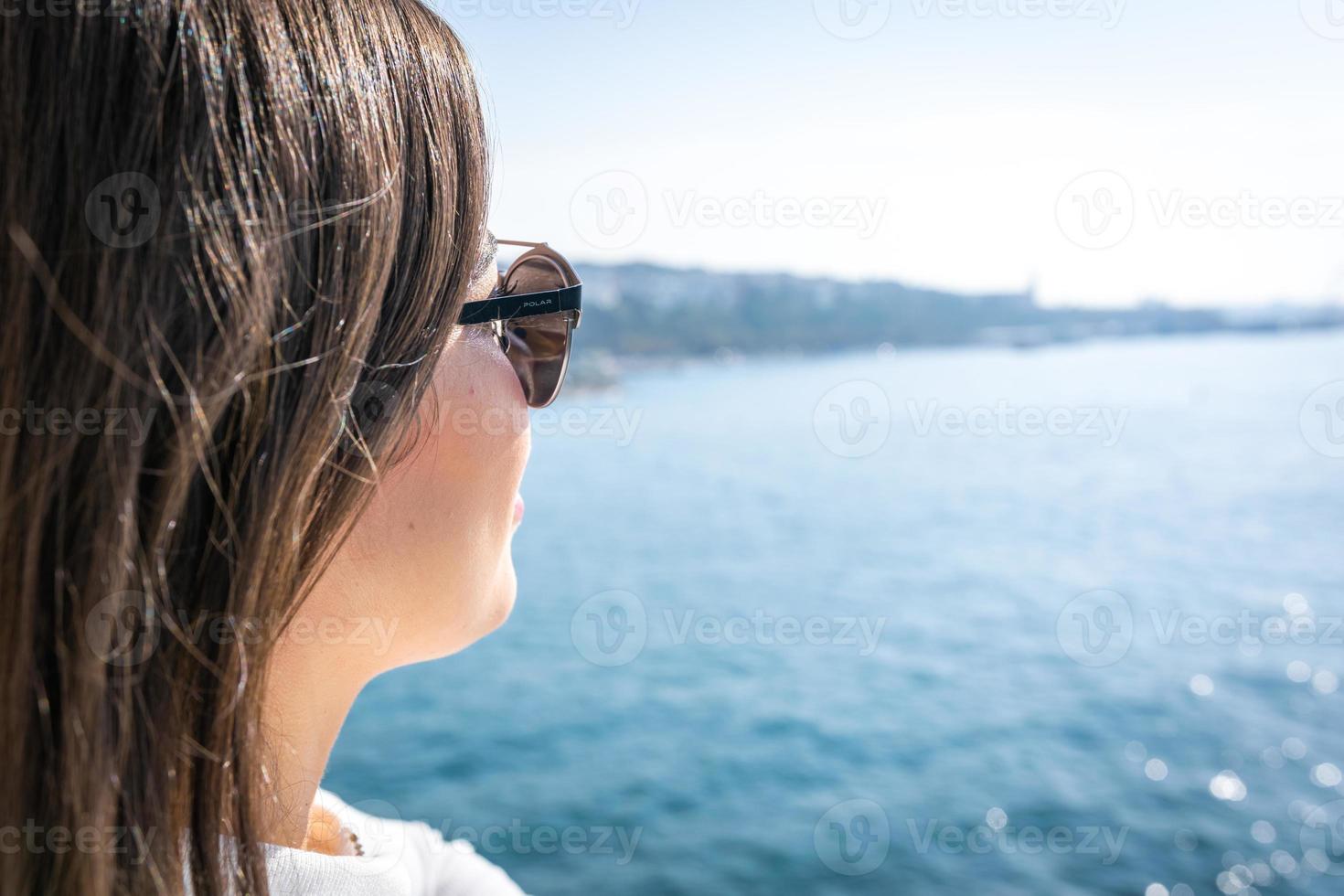 woman enjoy coast view photo