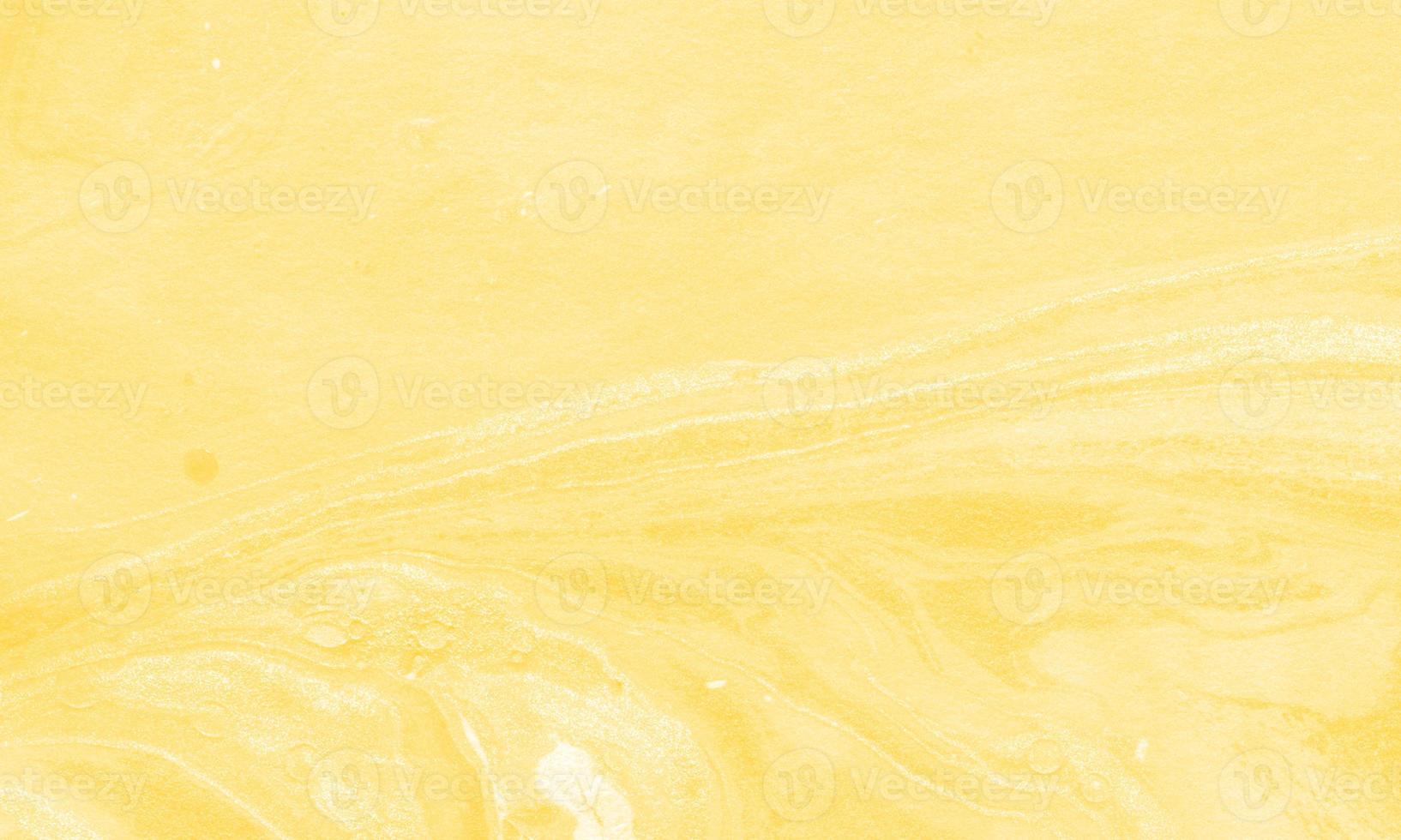 Abstract liquid marble painting background print with marigold color photo