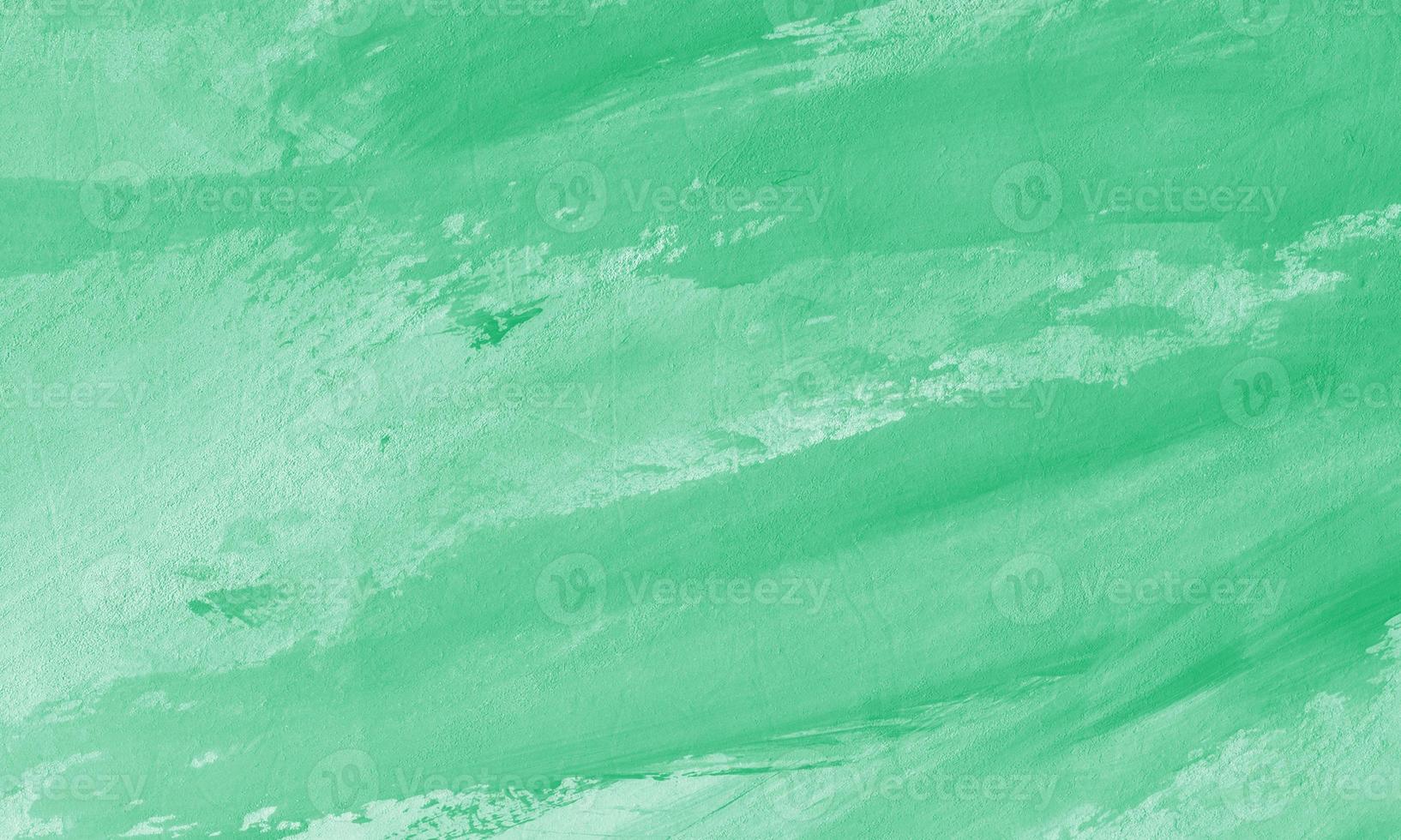 Creative abstract hand painted background with jade color photo
