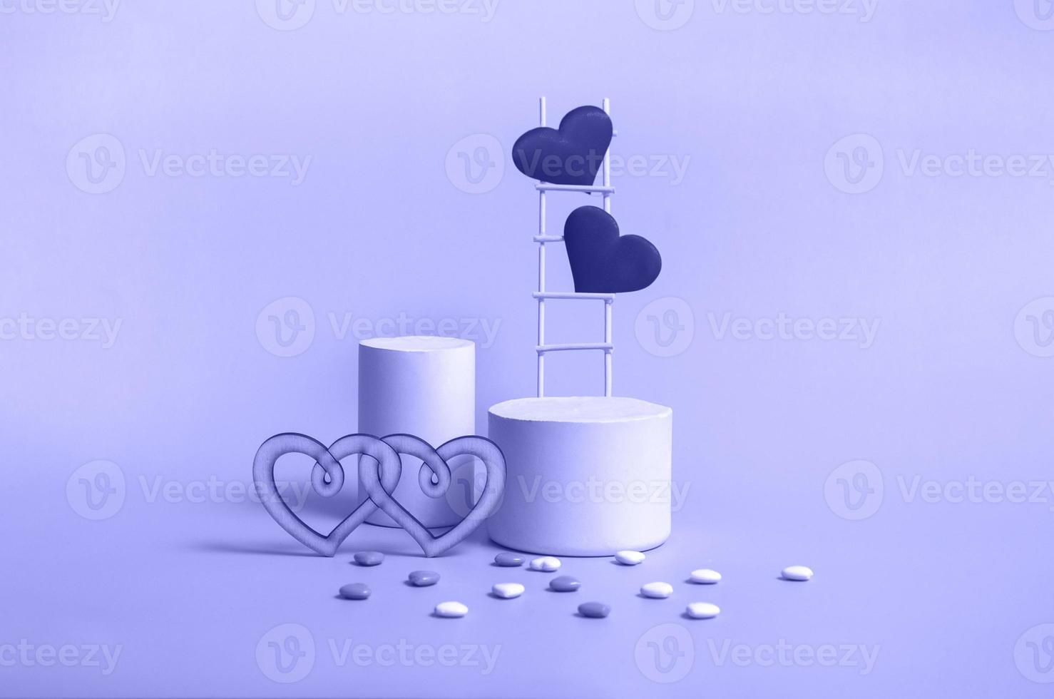 A podium with a wooden staircase and hearts in a trendy color very peri, monochrome. Celebrating Valentine's Day copy space. photo