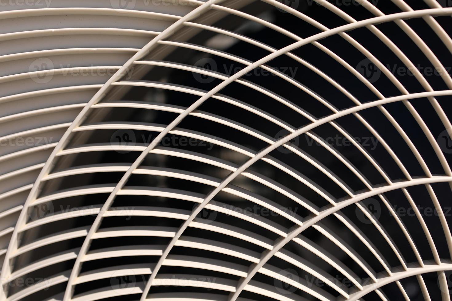 close up of air conditioner texture. Air condition cover texture. Gray protective plastic cover for air conditioner fan. Detail of industrial equipment. Close-up, abstract background, lattice pattern photo