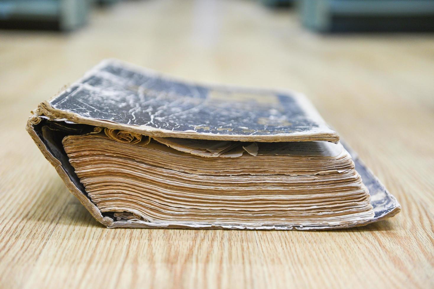 Book in the library room for business and education wall background - Old books on a wooden floor photo