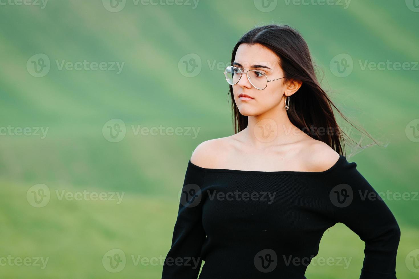 Elegant girl walking at green meadow photo