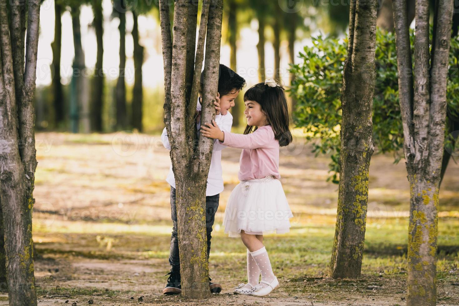 Girl and boy in the park. Face to face photo