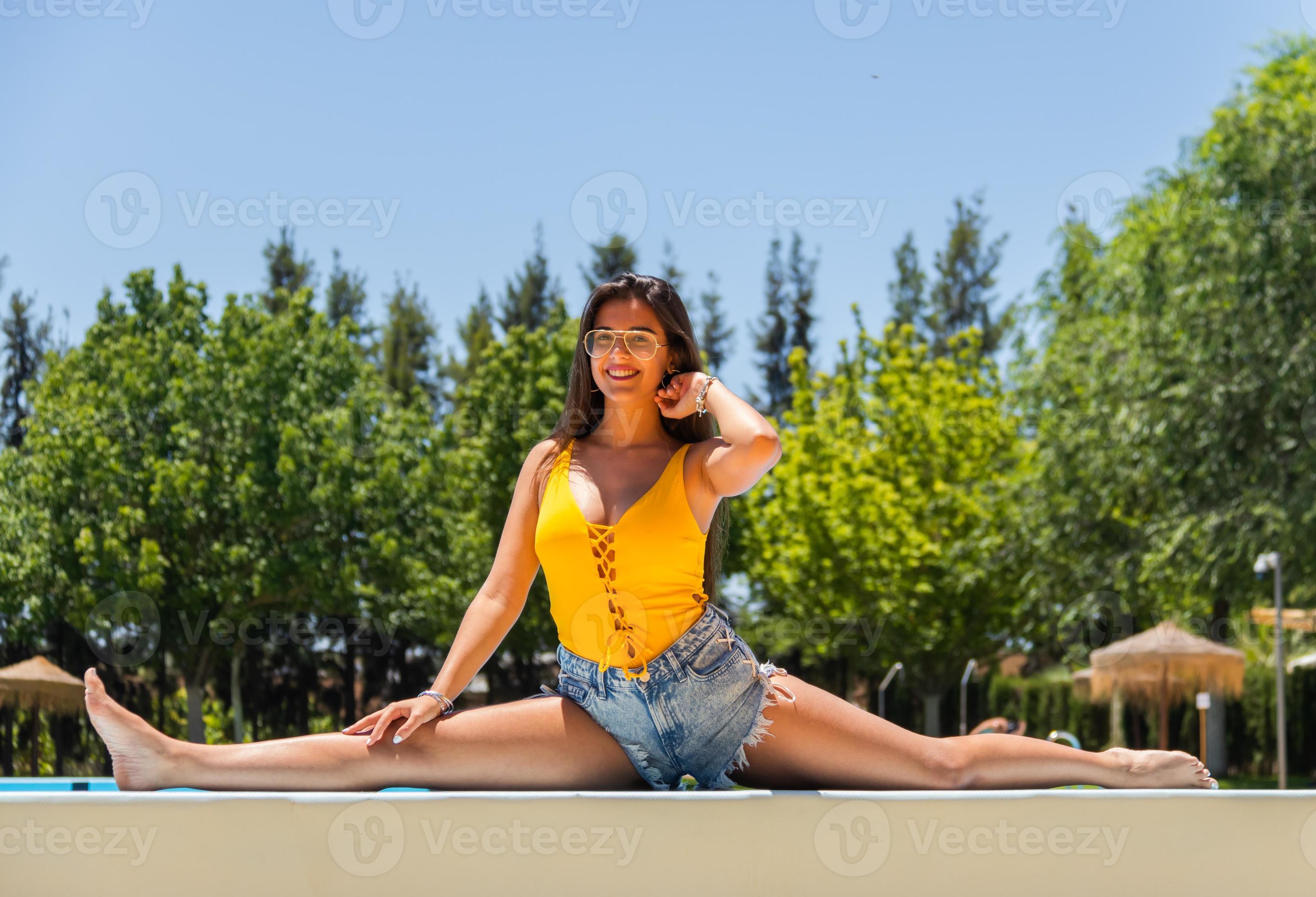 Girl stretching by the pool, spread her legs 4952065 Stock Photo