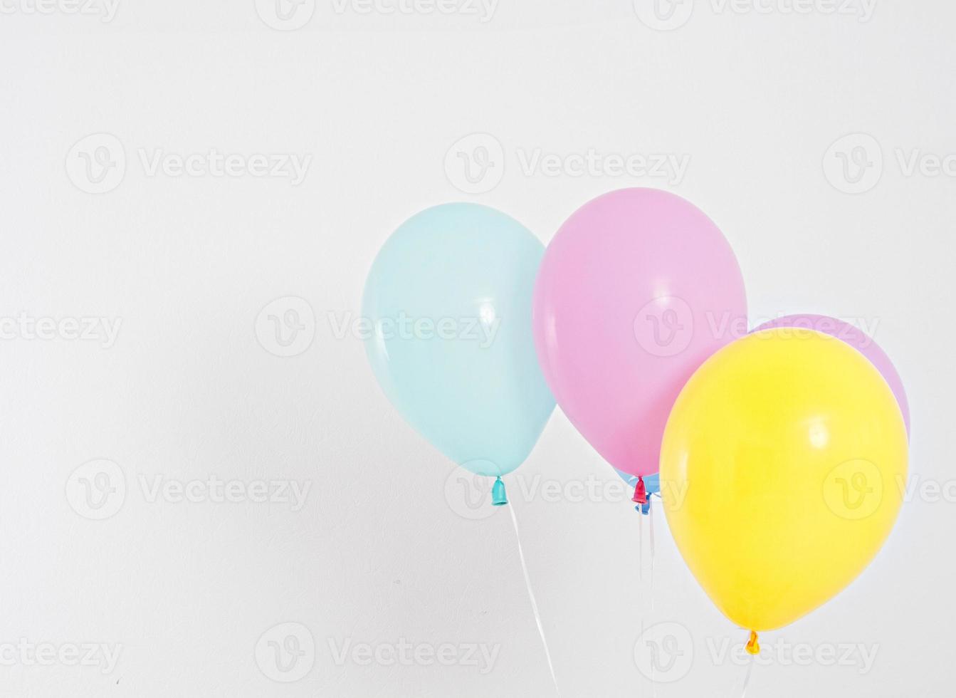 Colorful party balloons background. Isolated on white. Copy space photo