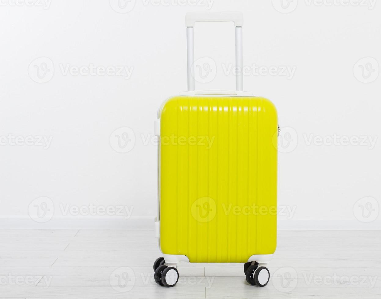 Yellow suitcase isolated on white background .Summer holidays. Travel valise or bag. Mock up. Copy space. Template. Blank. photo