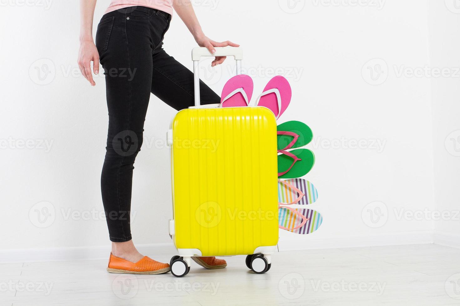 girl with suitcase isolated on white background .Summer holidays. summer flip flops or slippers. Travel valise or bag. Mock up. Copy space. Template. Blank. photo