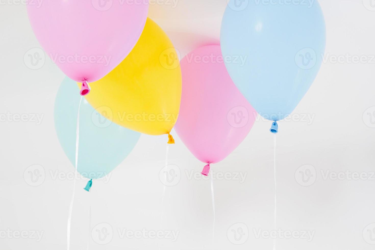 Colorful party balloons background. Isolated on white. Copy space photo