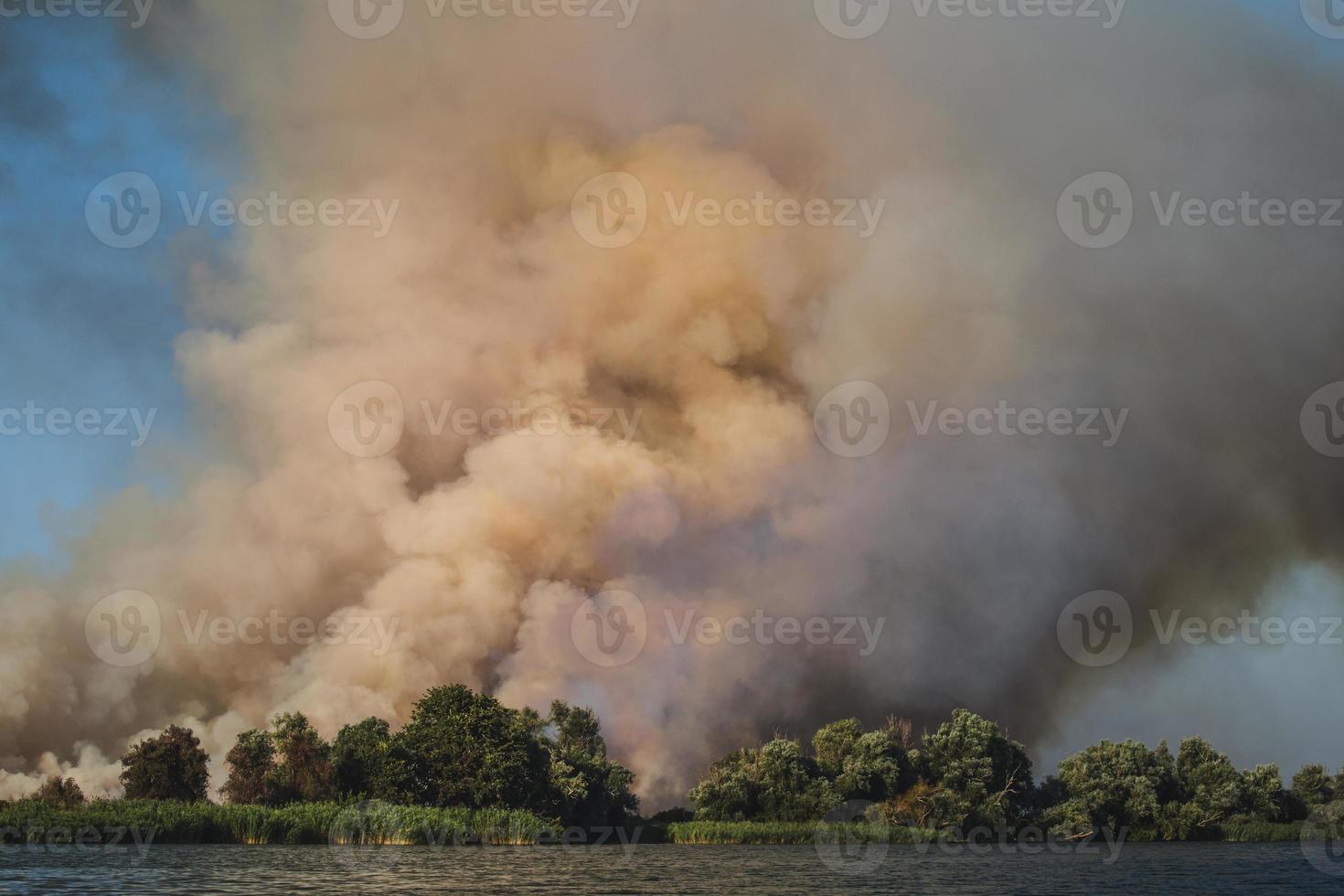 Large clouds of smoke, fire in nature. photo