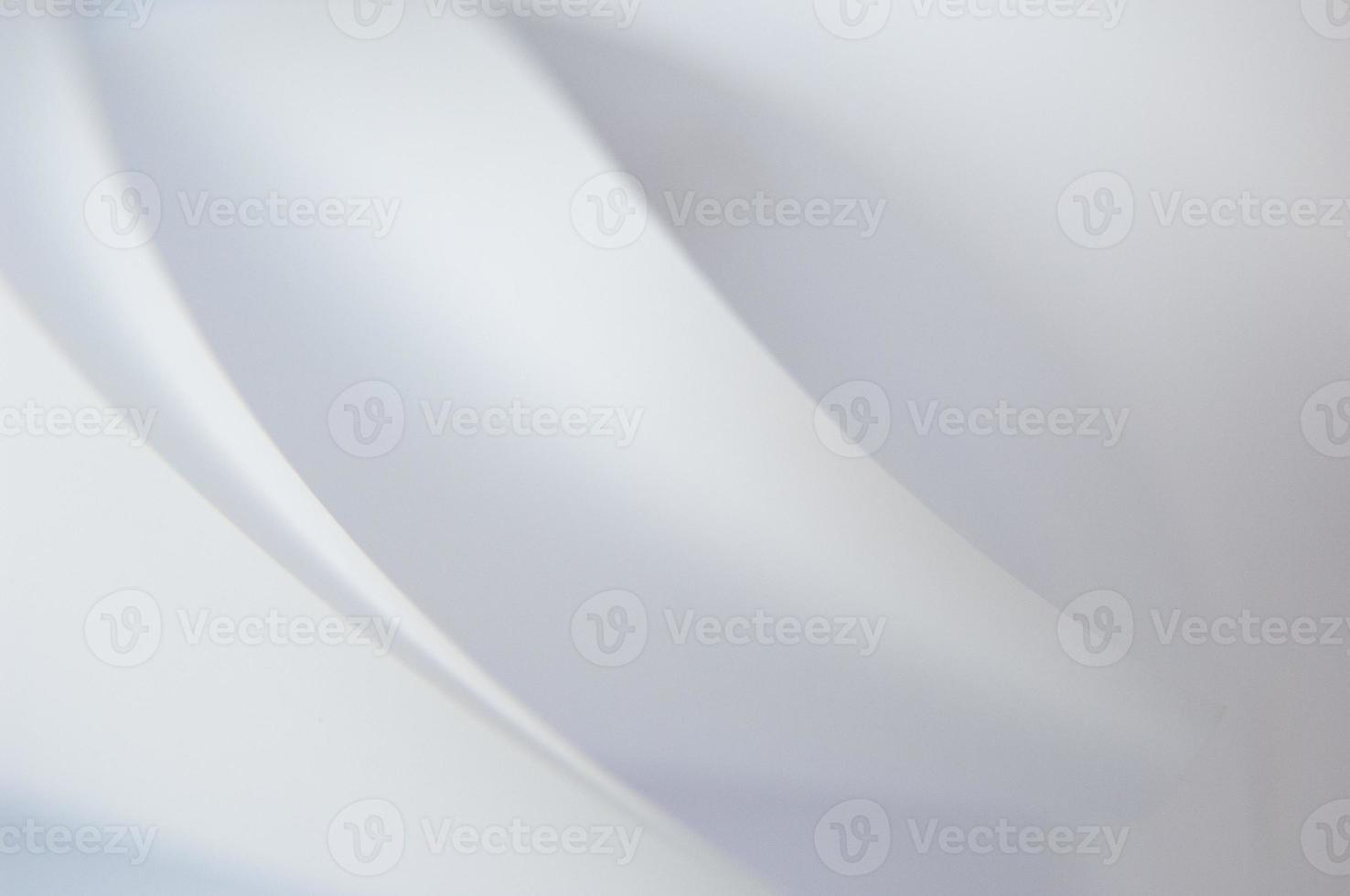 abstract background of a twisted sheet of white paper photo