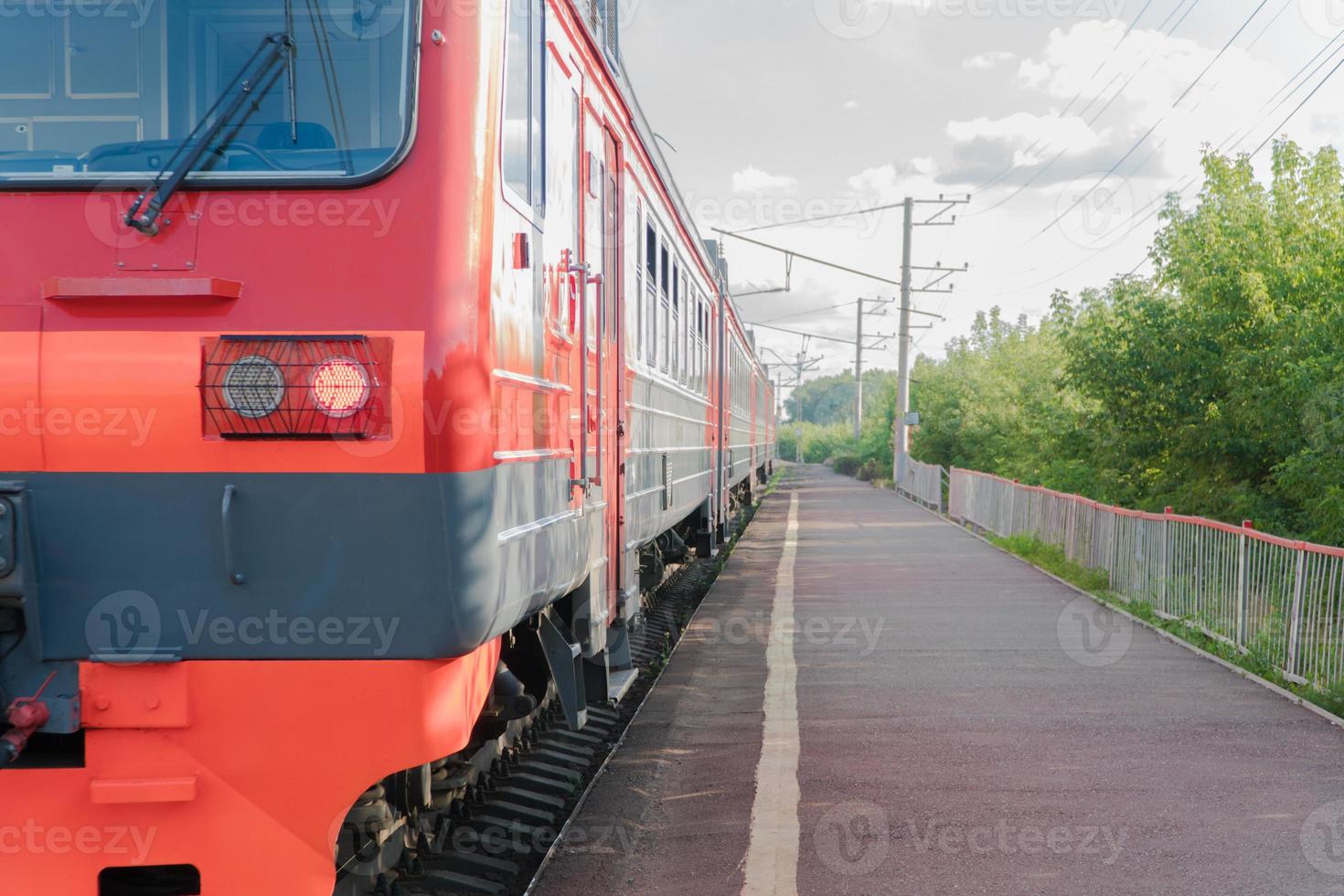 passenger train on the railway against the sky photo