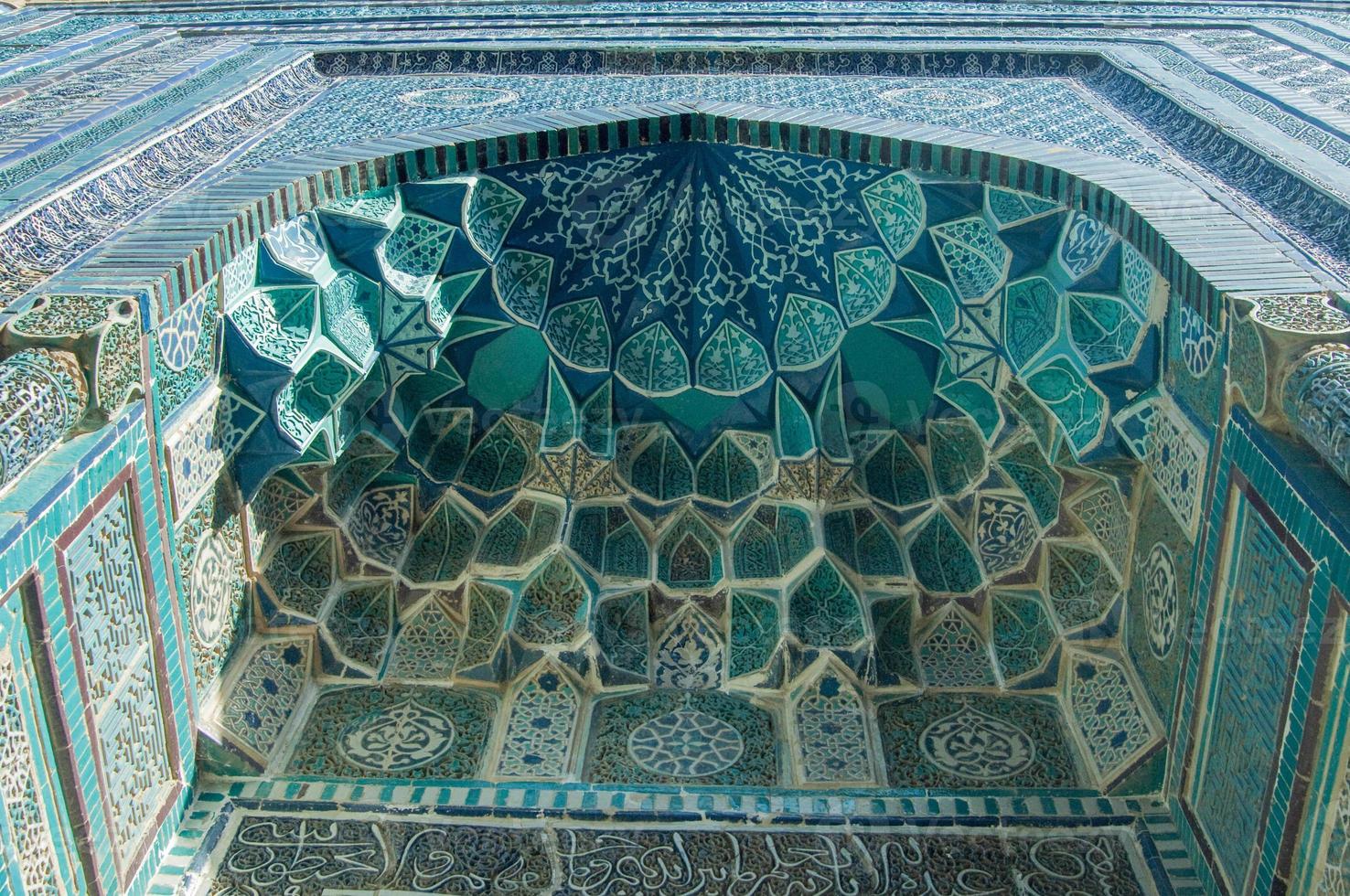 The dome in the form of an arch in traditional Asian mosaic. the details of the architecture of medieval Central Asia photo