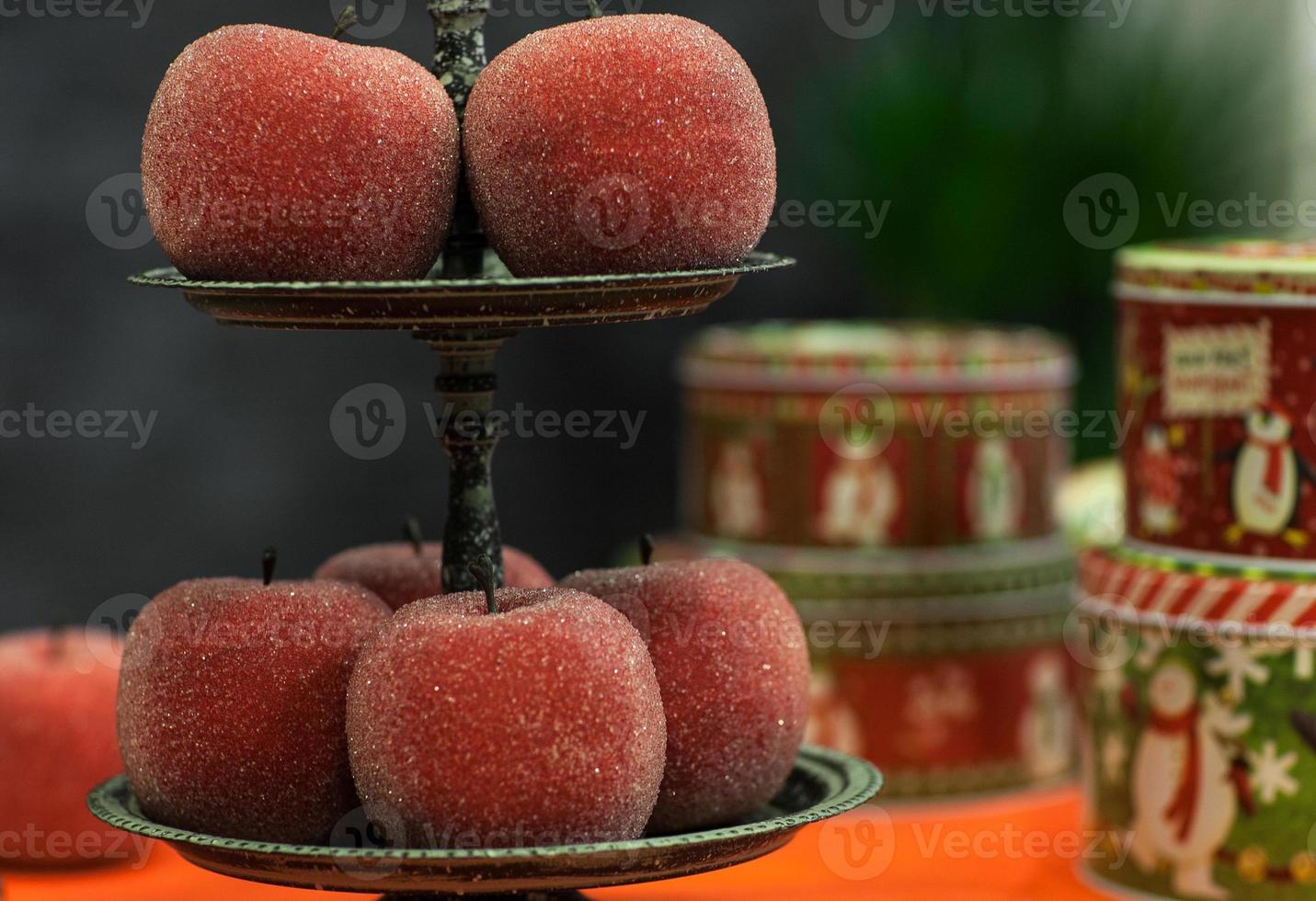 Decorative red apples in the sugar crumbs photo