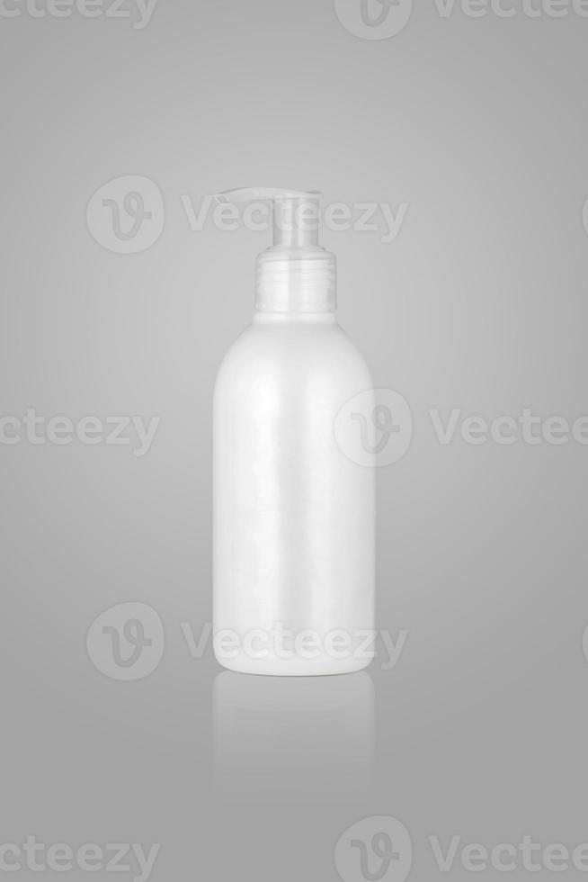 cosmetic container with pump on light background. bottle with gel photo