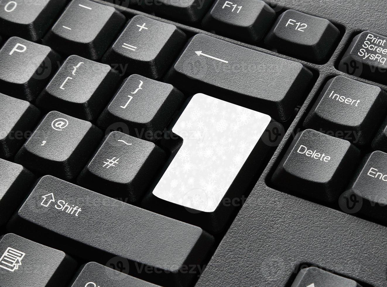 A Black Keyboard With Winter Snow Key photo