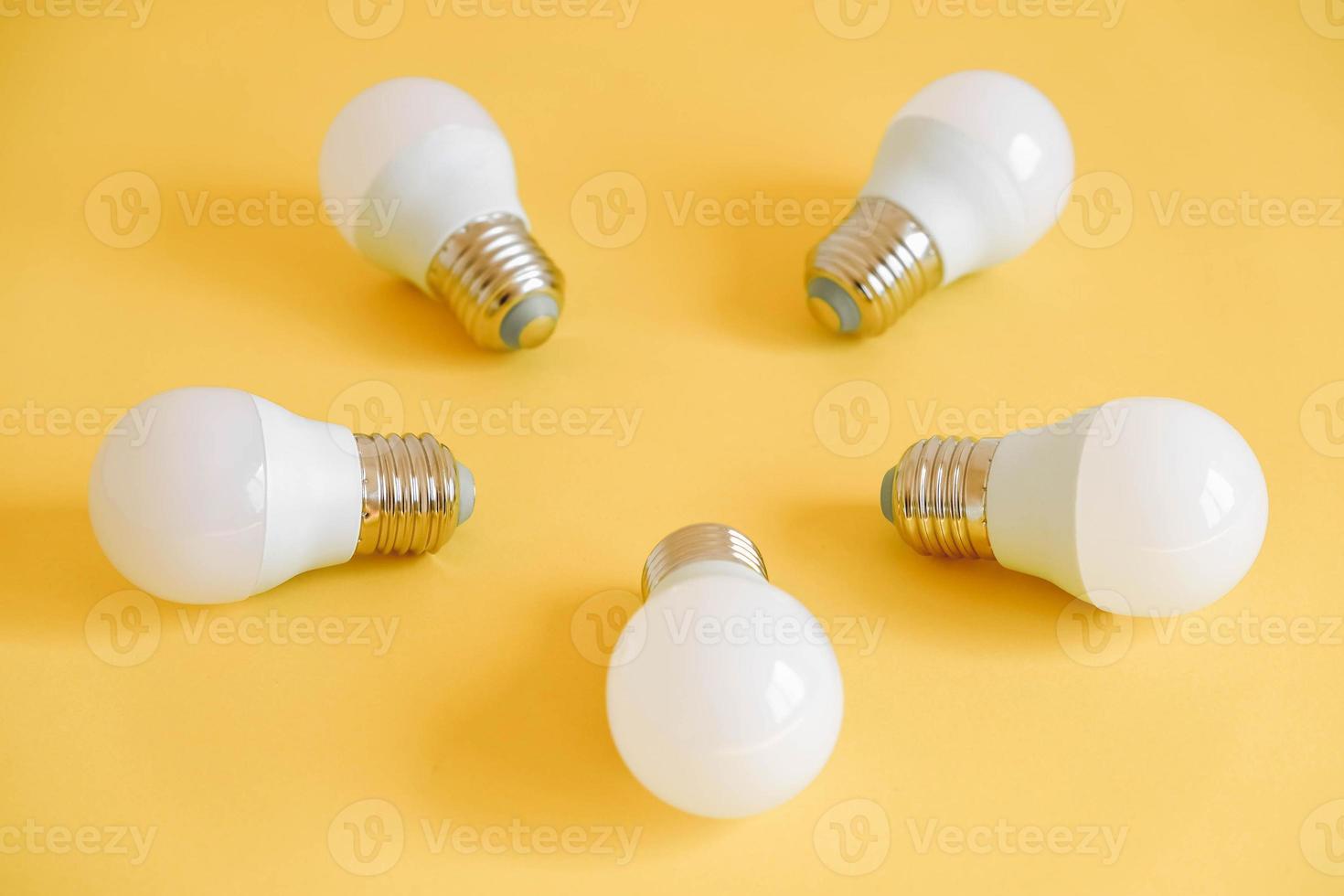 LED light bulbs on yellow background photo