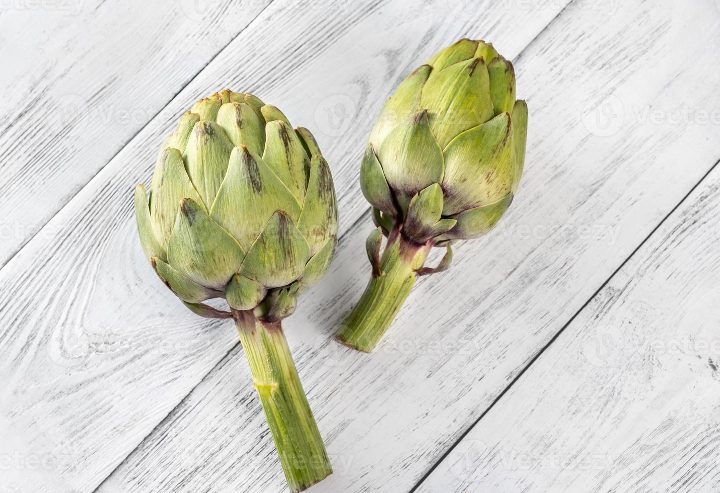 Green uncooked Artichoke photo