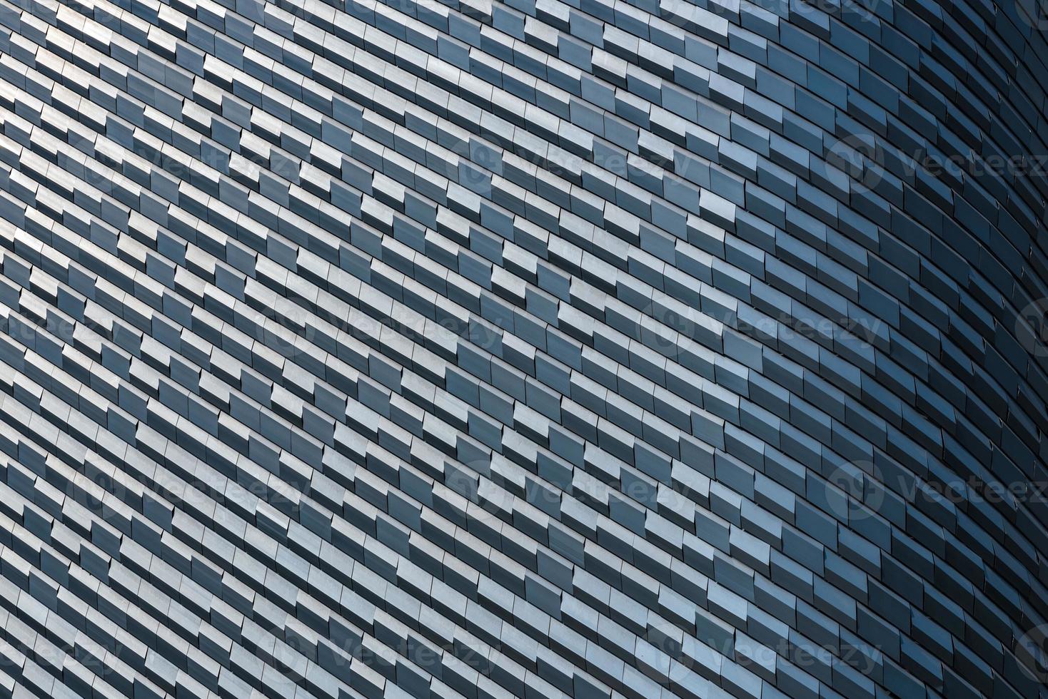 Geometric pattern in a tall building with lighting shade photo