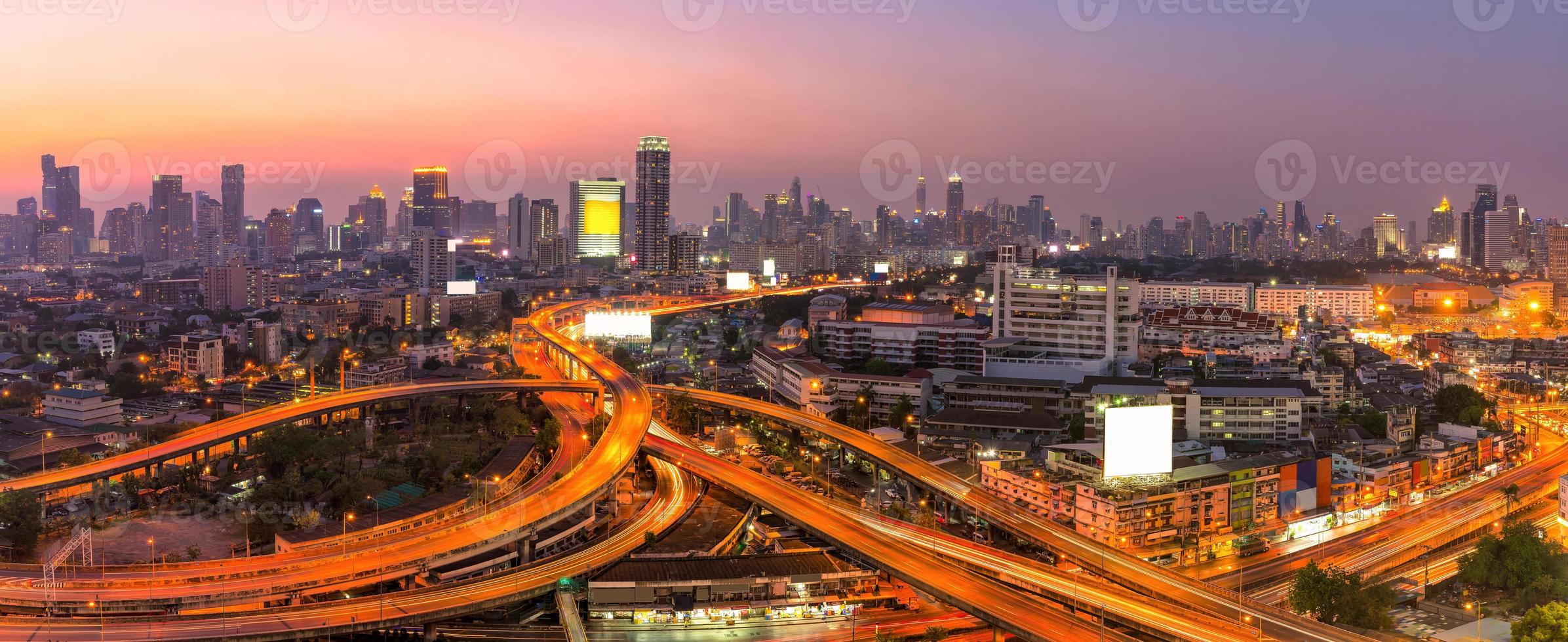 Panorama view of Modern office buildings, condominium in big city downtown with Motorway, Expressway, Freeway the infrastructure for transportation in modern city, urban view at twilight time photo