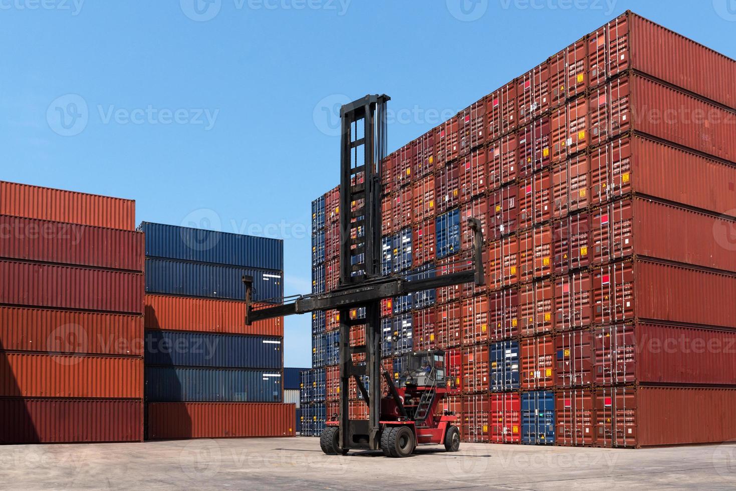 Cargo containers in shipping yard for import,export industrial against blue sky environment for transportation, import,export, logistic industrial photo