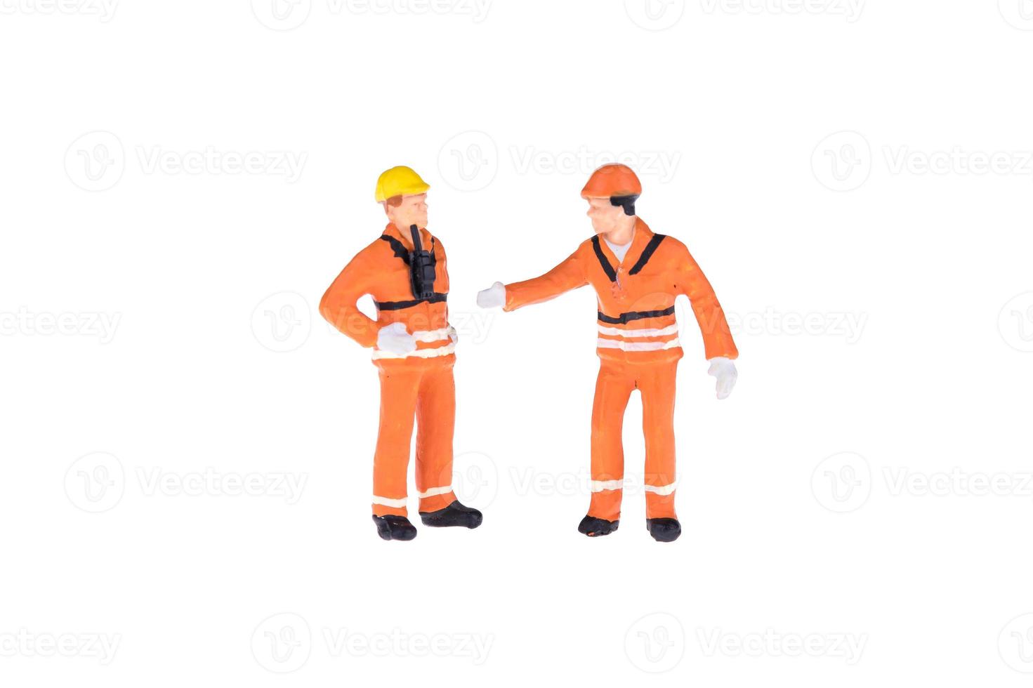 Close up of Miniature people in engineer and worker occupation isolate on white background. Elegant Design with copy space for placement your text, mock up for industrial and construction concept photo