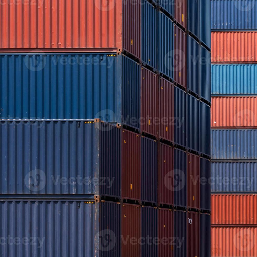 Colourful stack pattern of cargo shipping containers in shipping yard for logistic import and export industrial photo