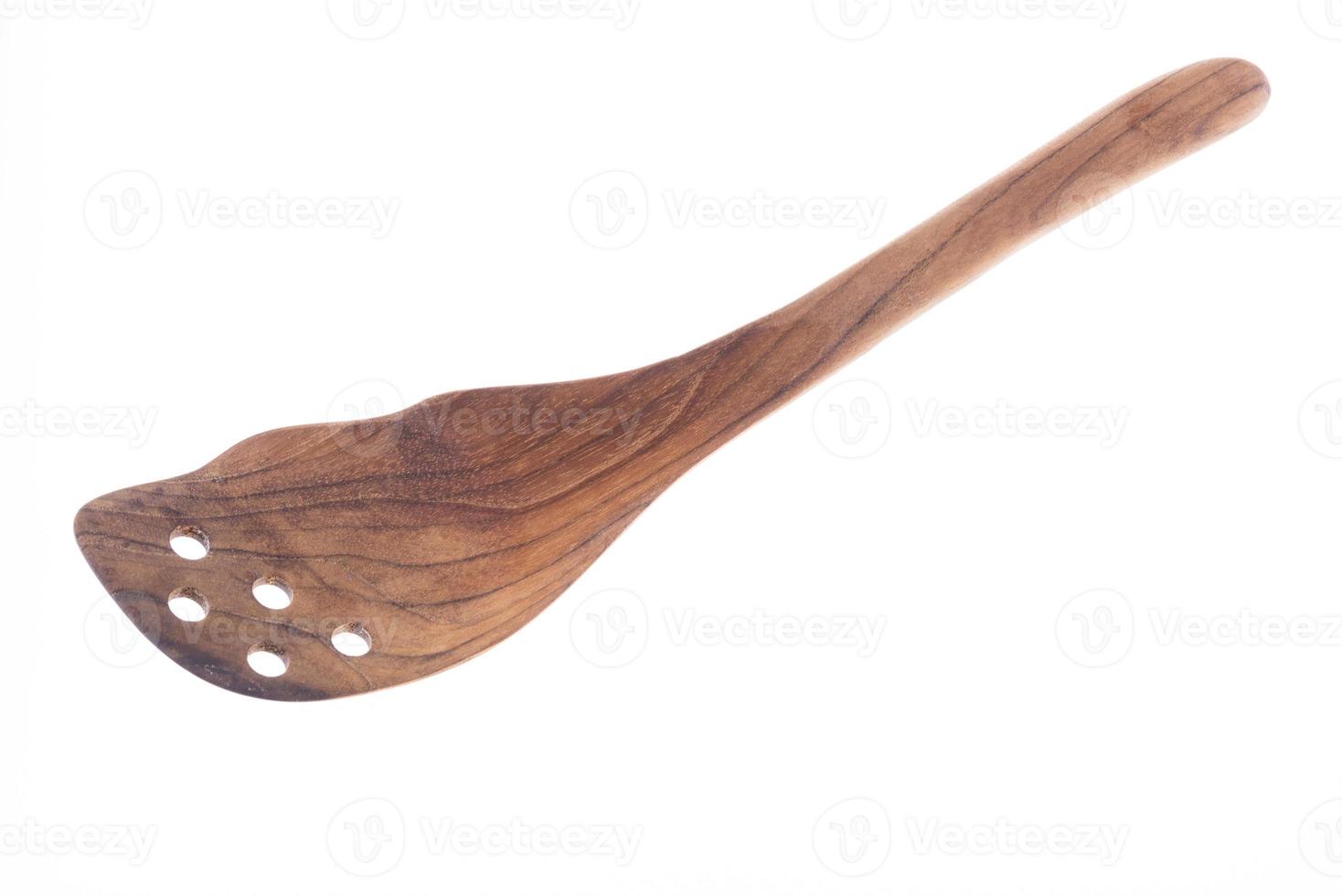 Natural Wooden spatula or flipper on white background. photo