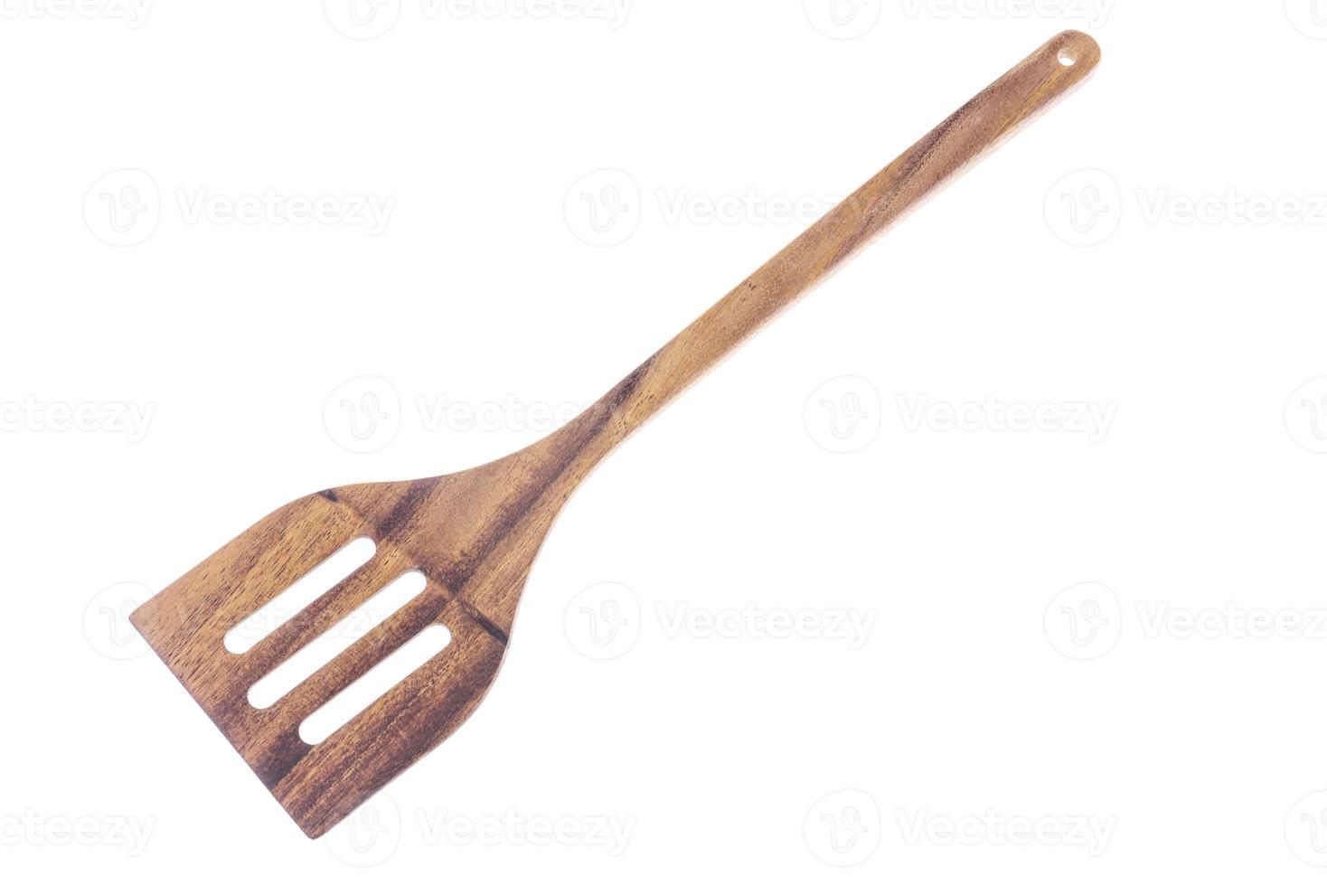 Natural Wooden spatula or flipper on white background. photo