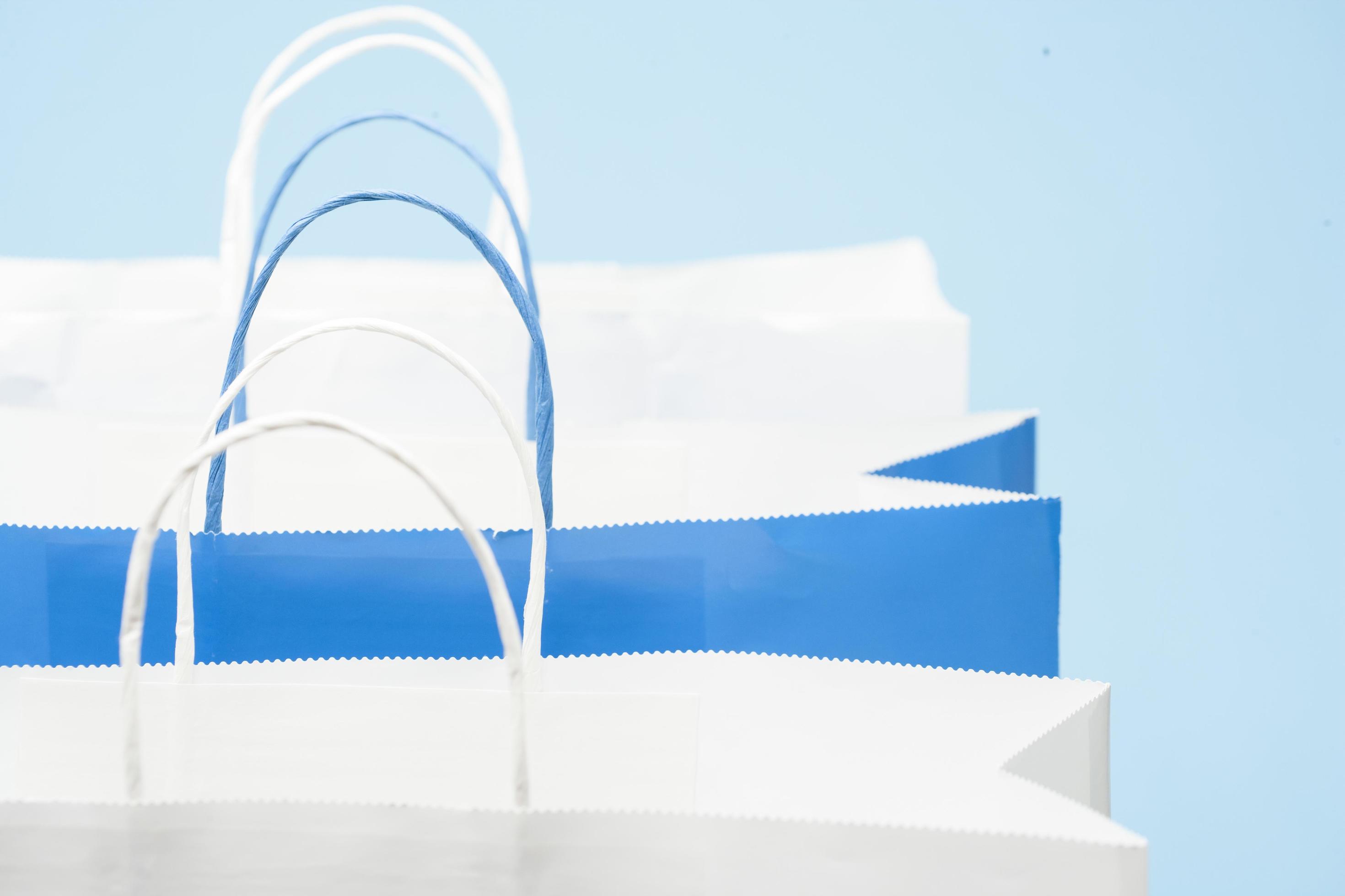Shopping bag on blue background 4954626 Stock Photo at Vecteezy