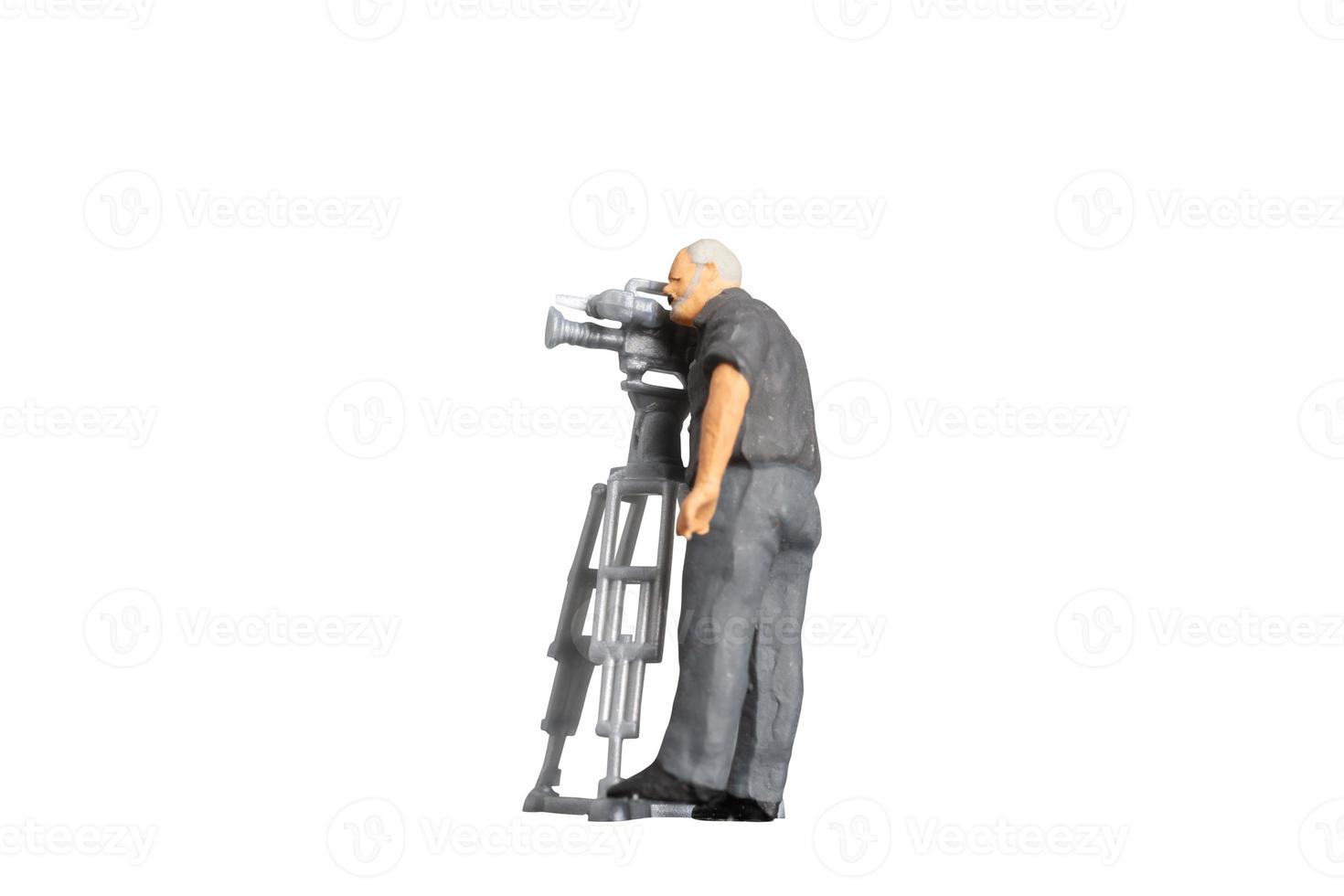 Cameraman working with television camera on a tripod isolated on white background with clipping path photo