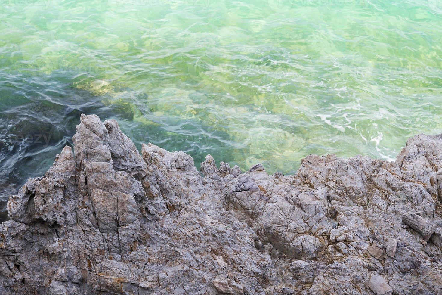 The texture of the stone and the sea. photo