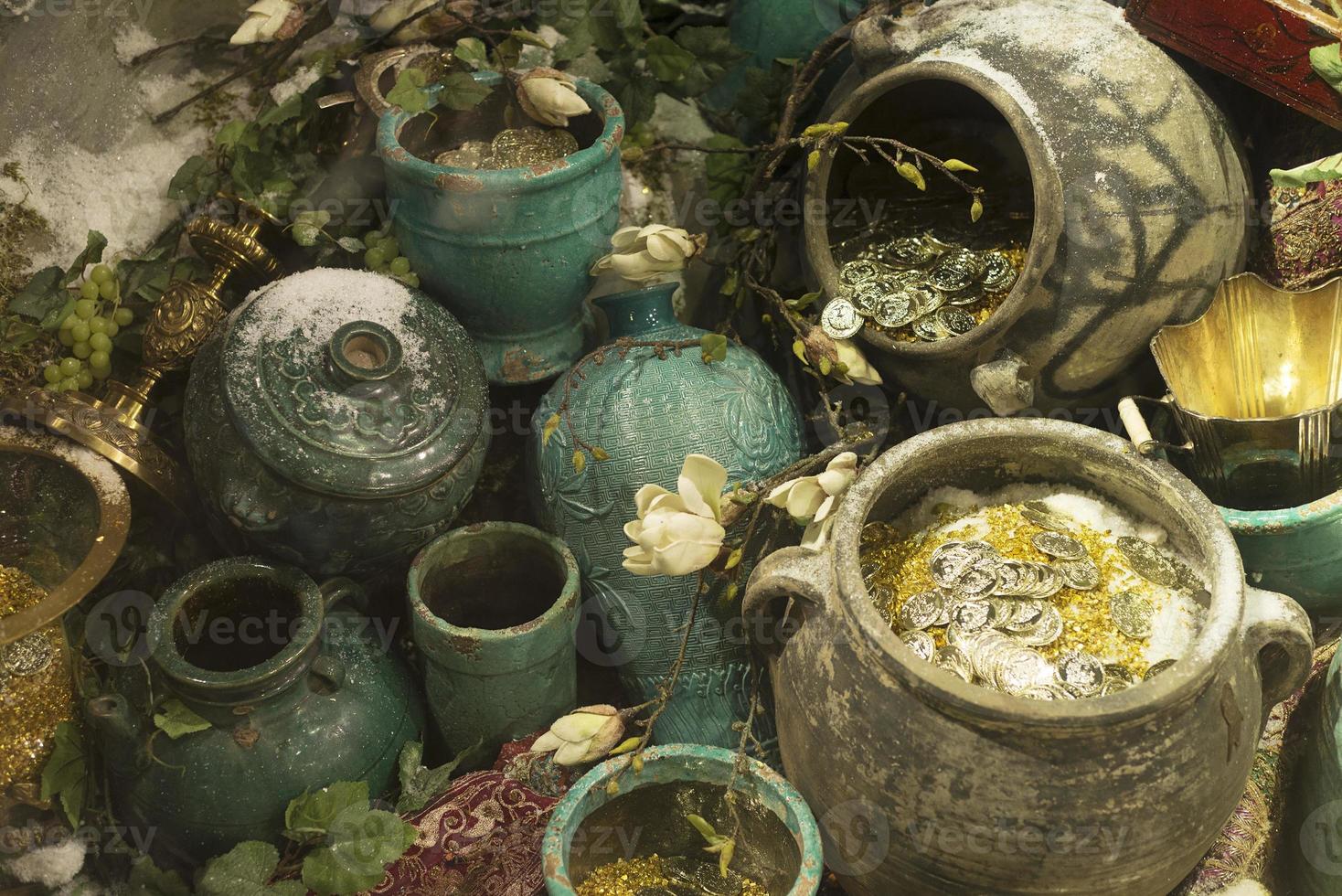 Pots with gold coins, find treasure hunt. photo