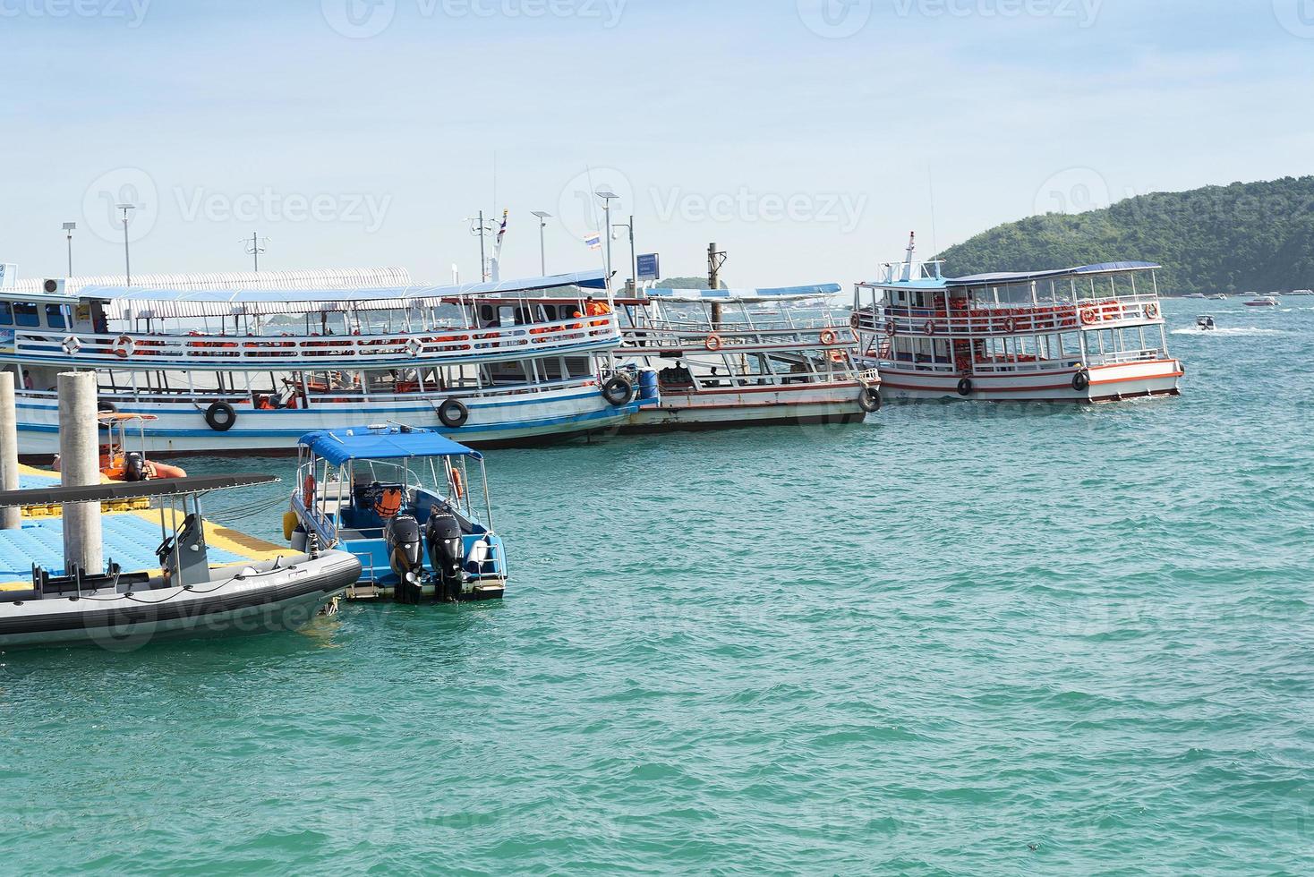 Parking fishing vessels on the island in Thailand. photo