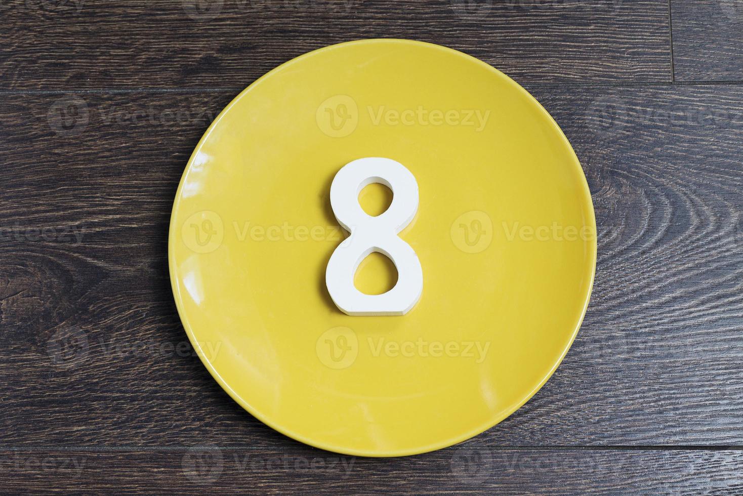 Figure eight on a yellow plate. photo