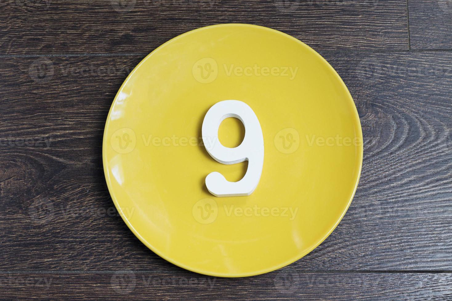 Number nine on the yellow plate. photo