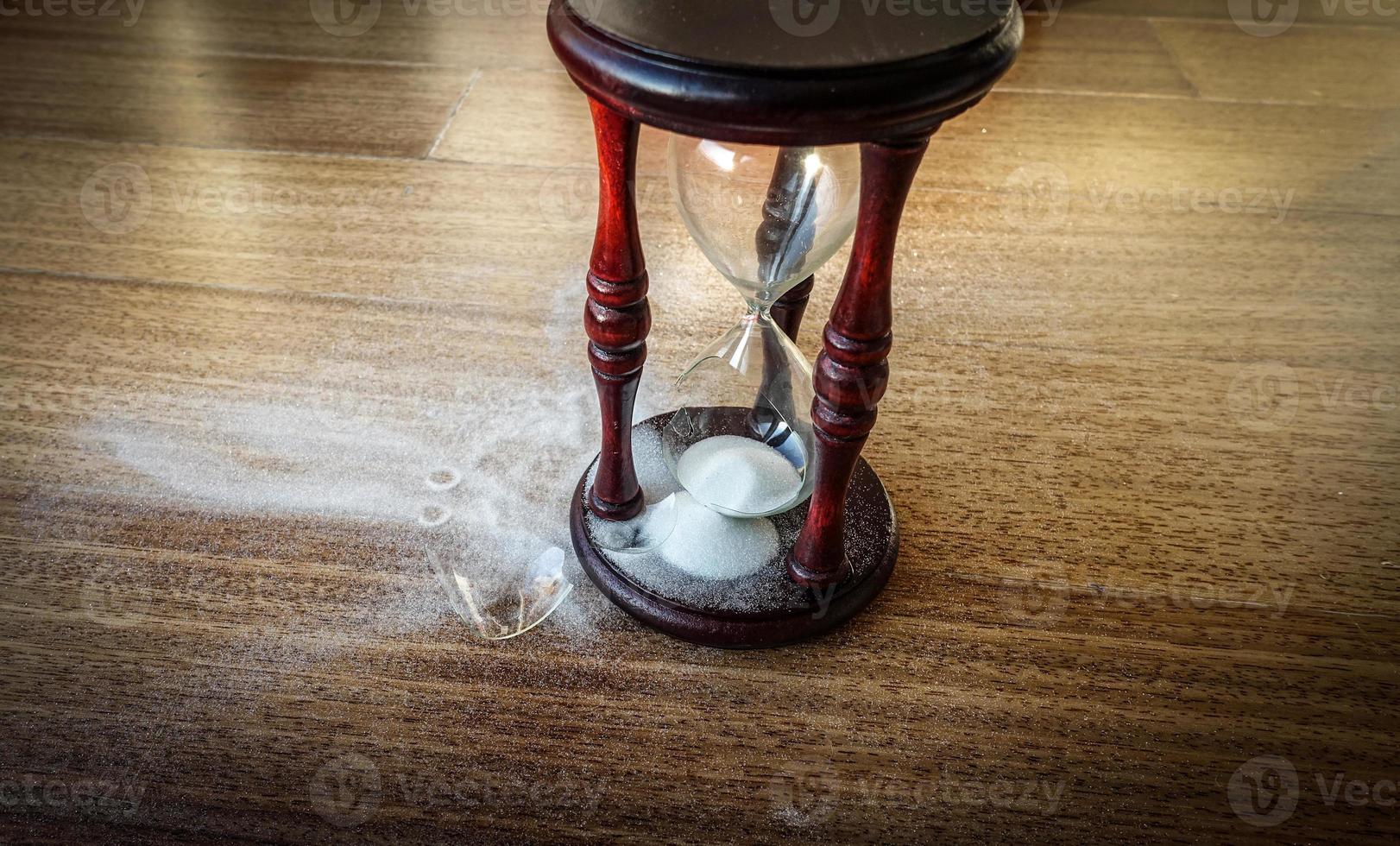 Broken hourglass - sand clock photo