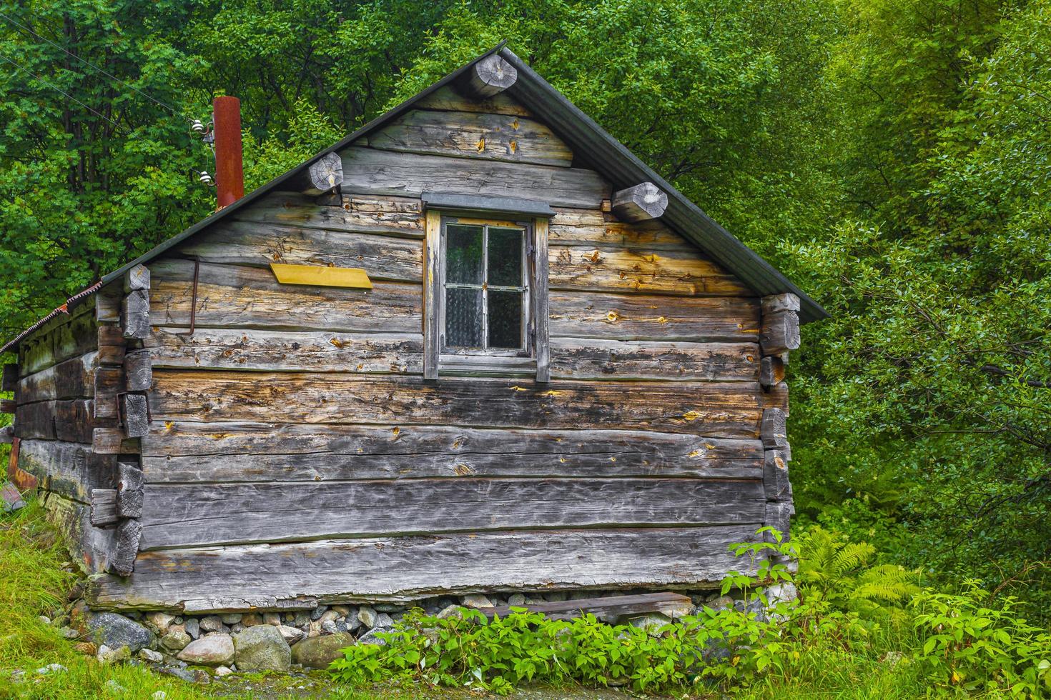Old wooden cabin hut in Utladalen Norway Most beautiful landscapes. photo