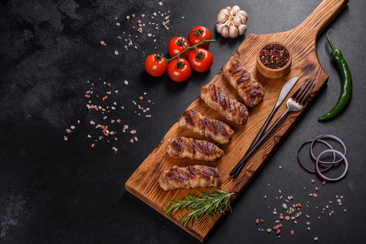 A delicious dish of pork mince wrapped with delicious pieces of bacon photo
