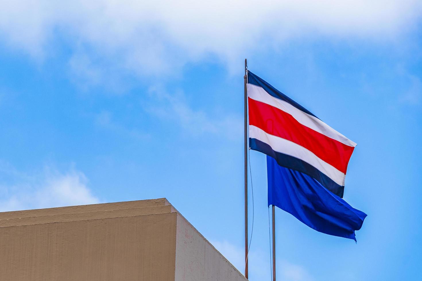 Flag of Costa Rica old buildings behind Costa Rican flag. 4956626 Stock