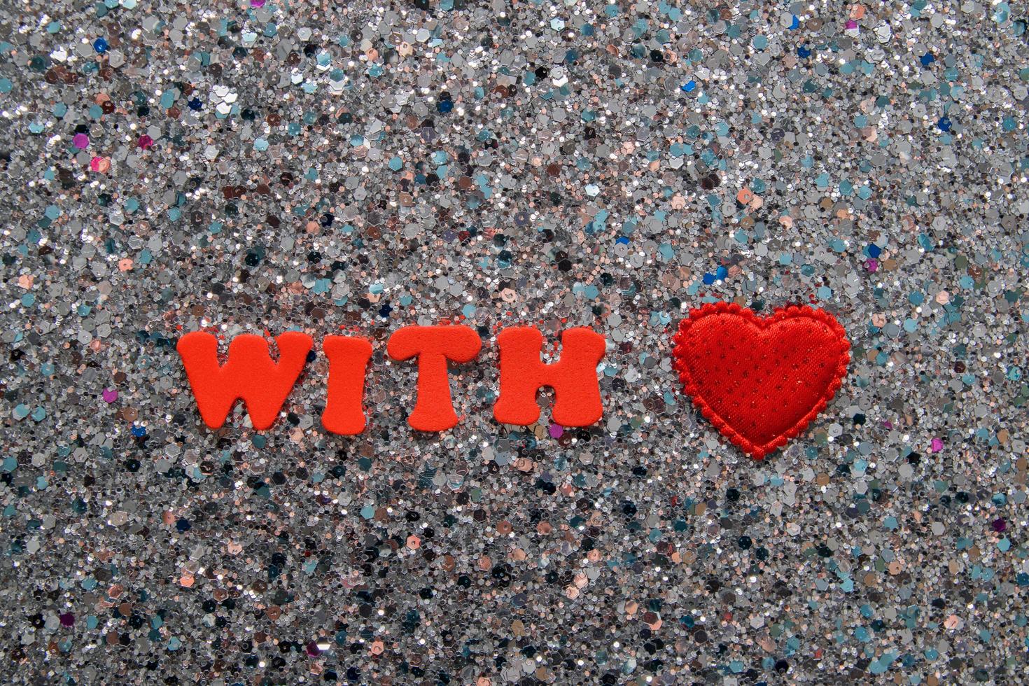 The words with love on a shiny glitter background photo