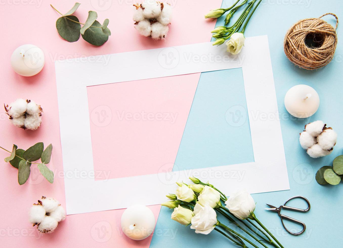 White frame and cotton flowers photo