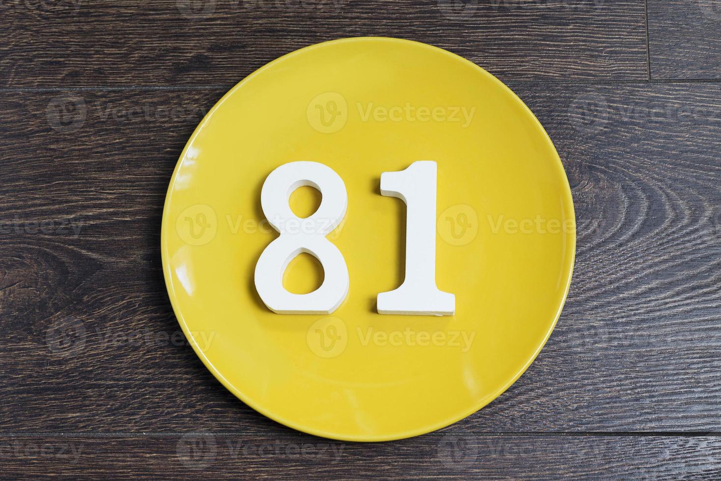 The number eighty-one on the yellow plate. photo