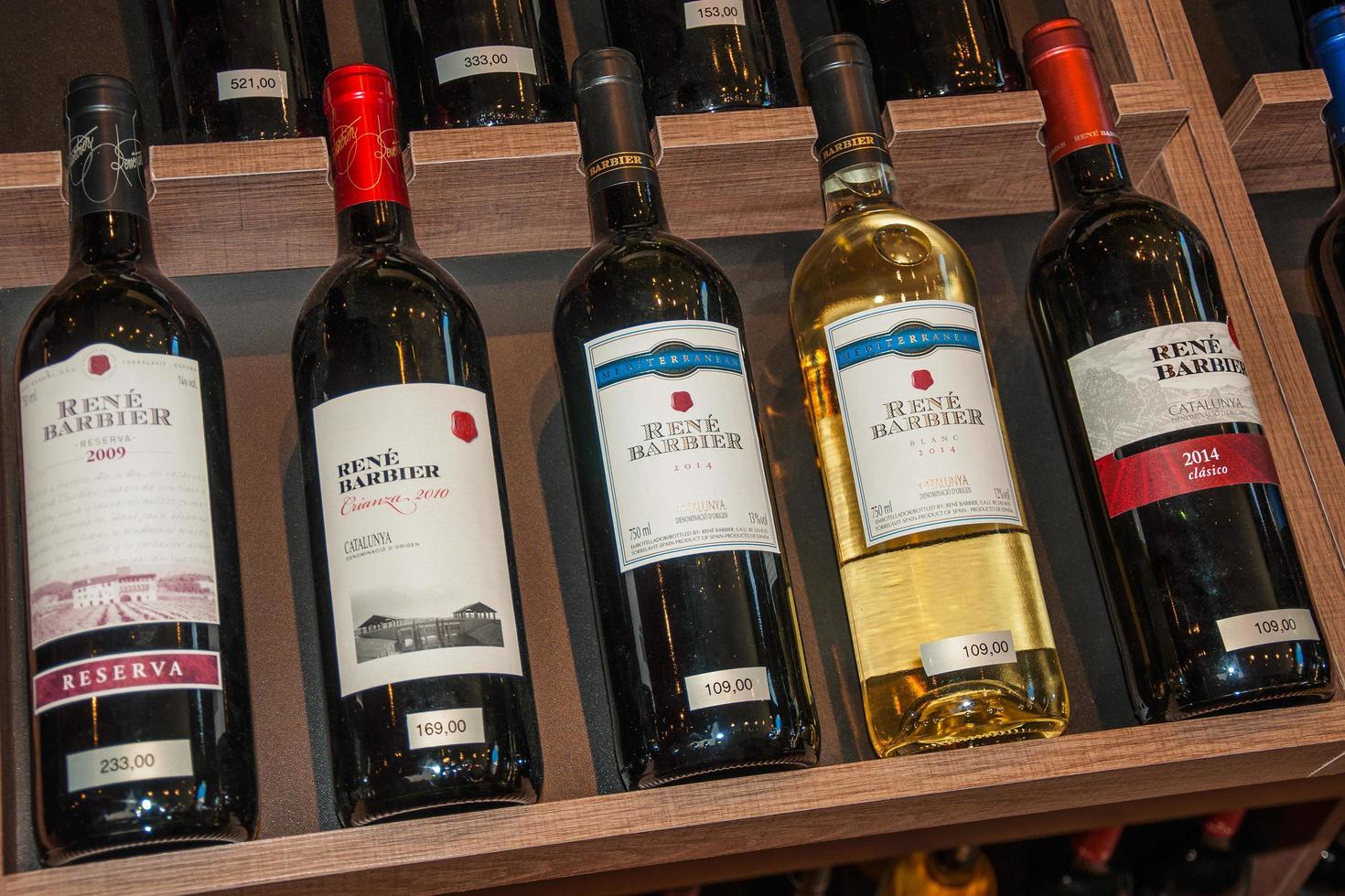 Sao Paulo, Brazil, August 10, 2019. Several bottles of wine for sale displayed on shelves from a wine shop of Sao Paulo. The gigantic city, famous for its cultural and business vocation. photo