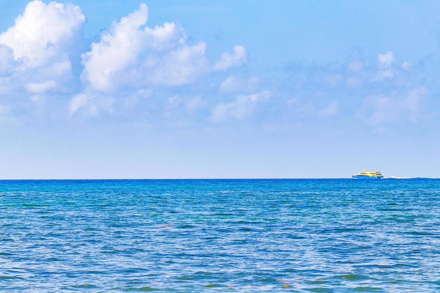 Boat ferry at Tropical mexican beach Playa del Carmen Mexico. photo